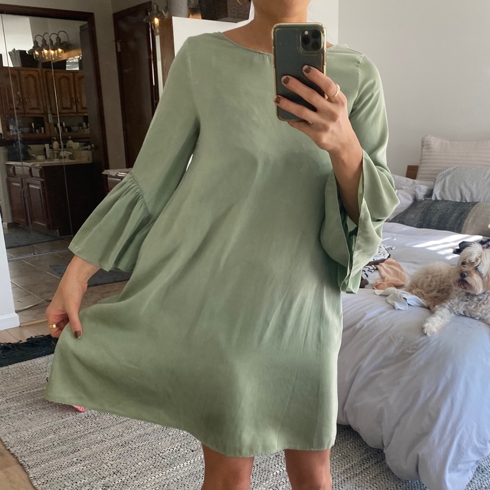 Soft sage green babydoll dress with bell sleeves